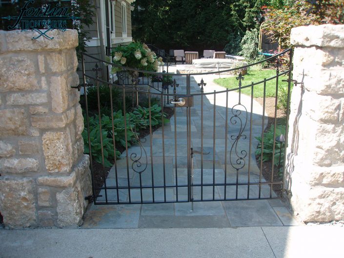 stone pillar attached walk through gate