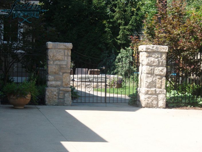 stone pillar attached walk through gate