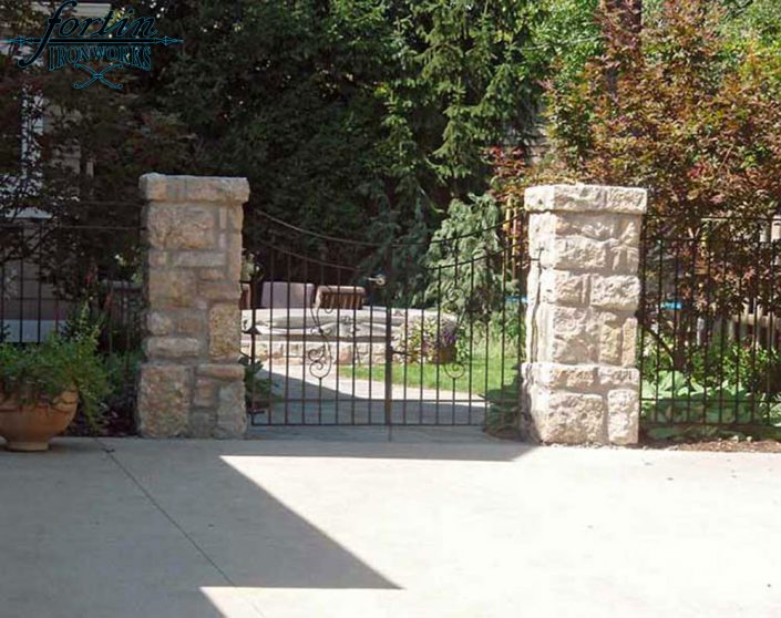 stone pillar attached walk through gate