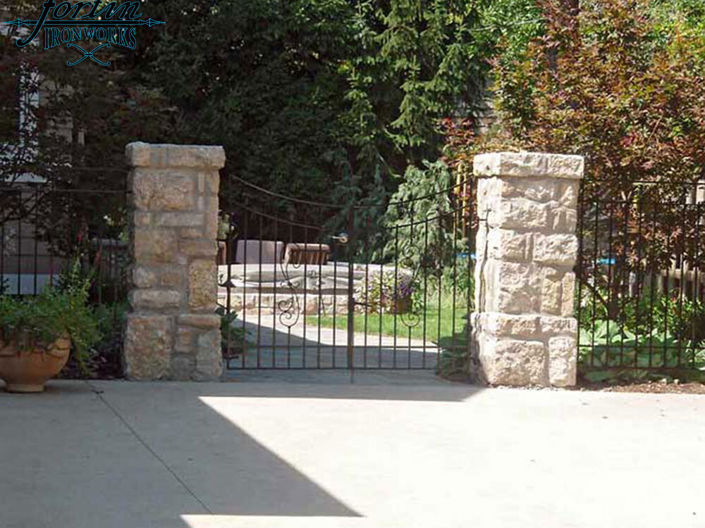 stone pillar attached walk through gate