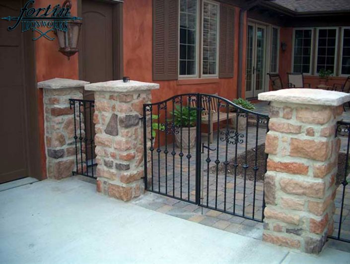 stone pillar attached walk through gate